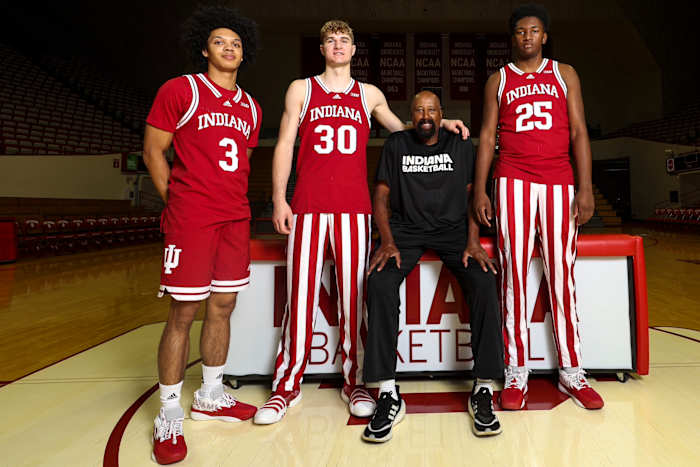 Montverde Academy teammates Curtis Givens III (3), Liam McNeeley (30), Derik Queen (25) and Indiana coach Mike Woodson pictured together at Simon Skjodt Assembly Hall in Bloomington, Ind.